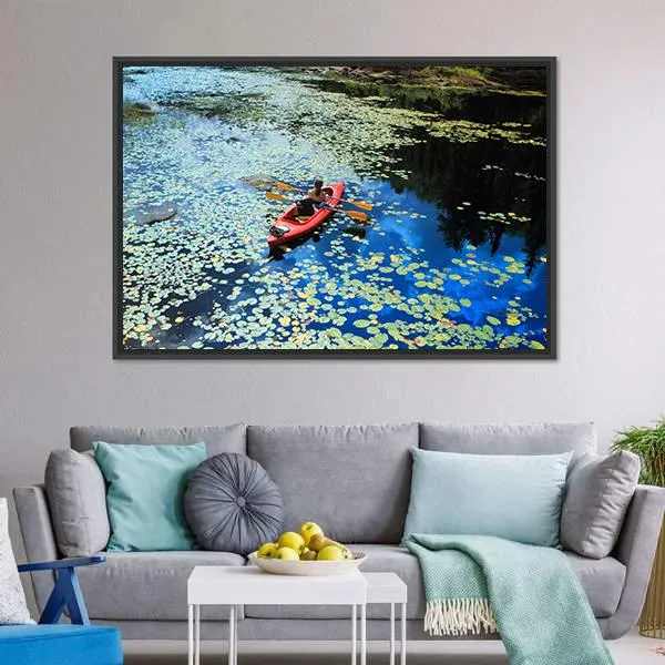 Canoeing In Water Lilies Canvas Wall Art