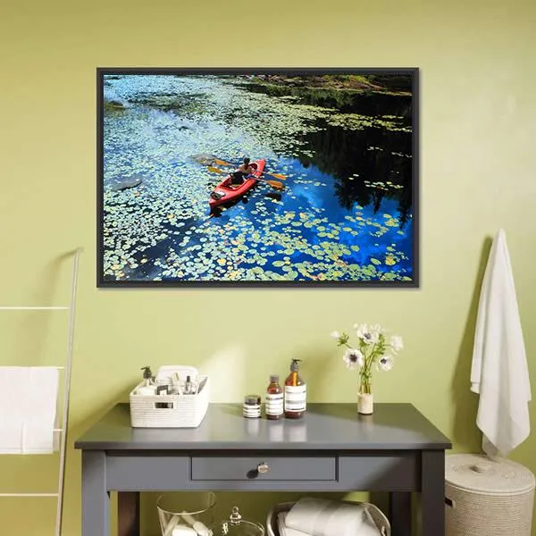 Canoeing In Water Lilies Canvas Wall Art