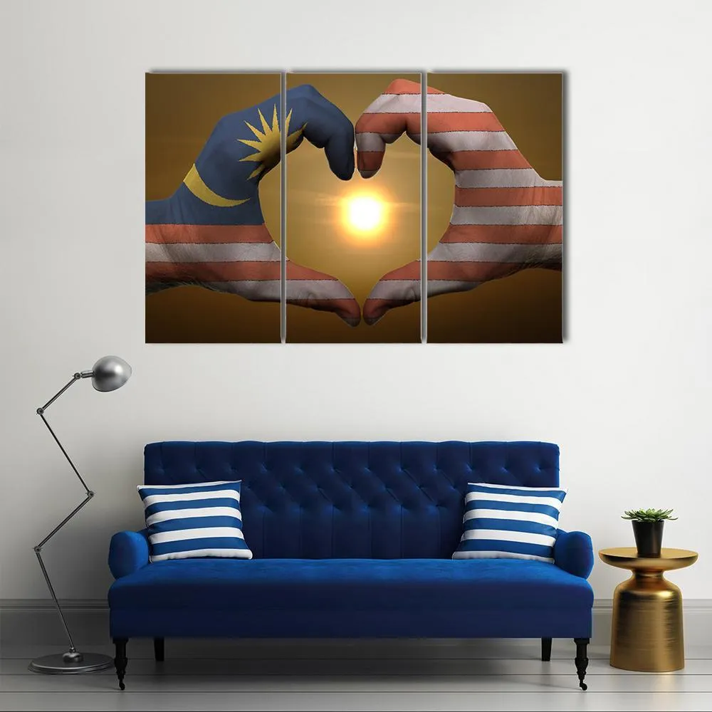 Malaysia Flag On Hands Canvas Wall Art