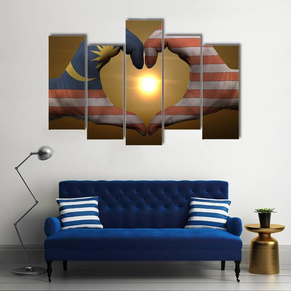 Malaysia Flag On Hands Canvas Wall Art