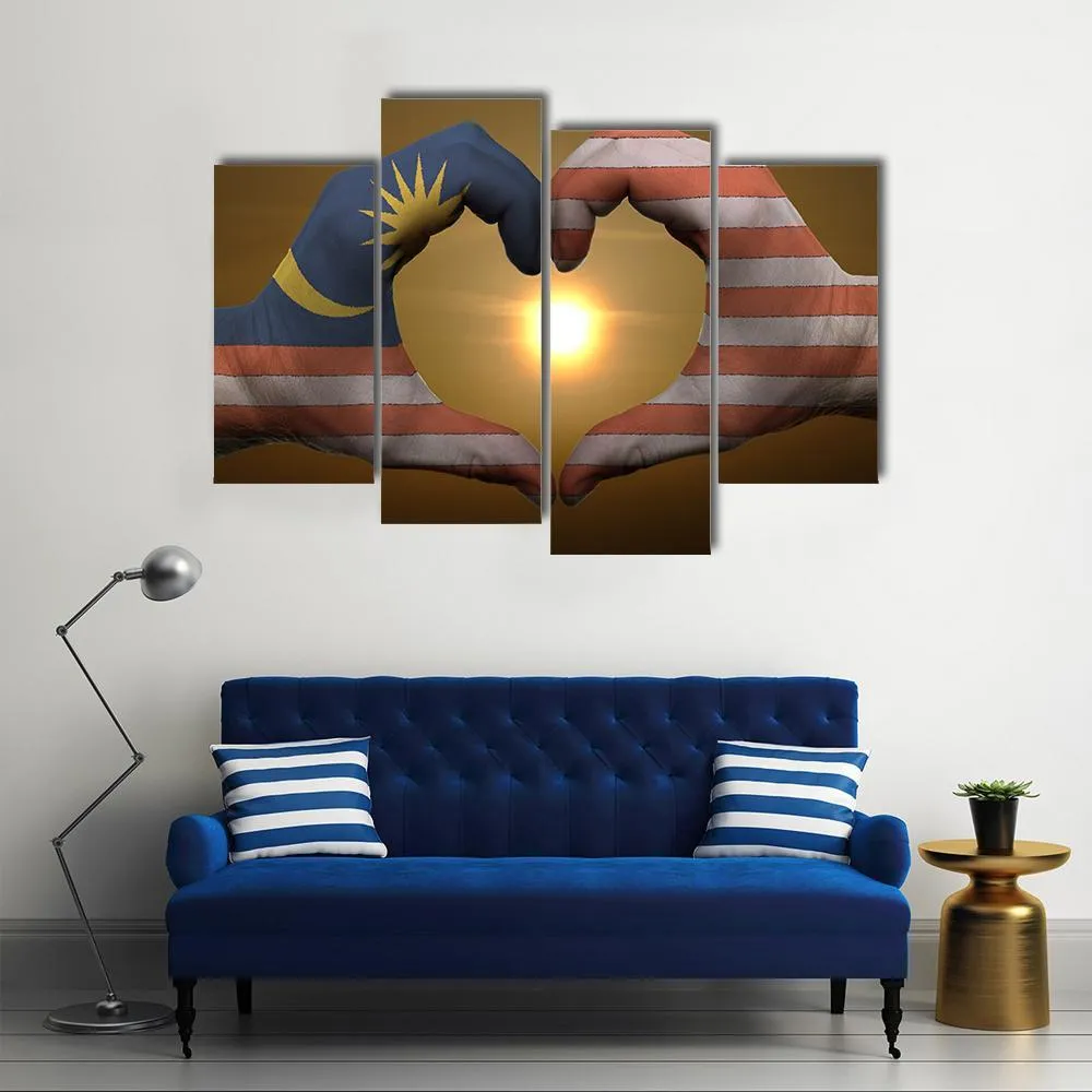 Malaysia Flag On Hands Canvas Wall Art