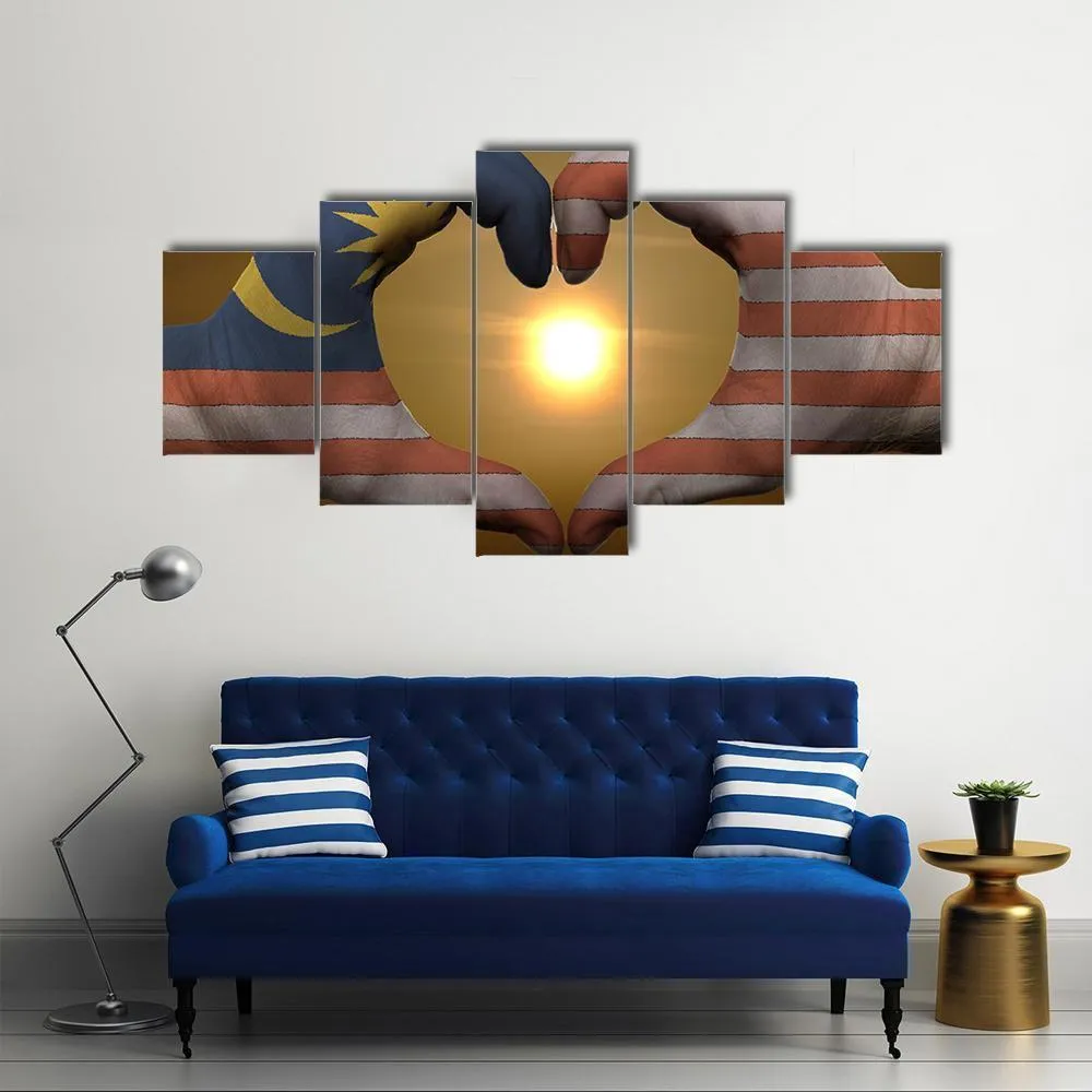 Malaysia Flag On Hands Canvas Wall Art